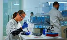 scientist-modern-equipped-medical-laboratory-examinining-drug-