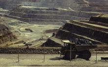 Open cast mine landscape wtih heavy mining vehicles